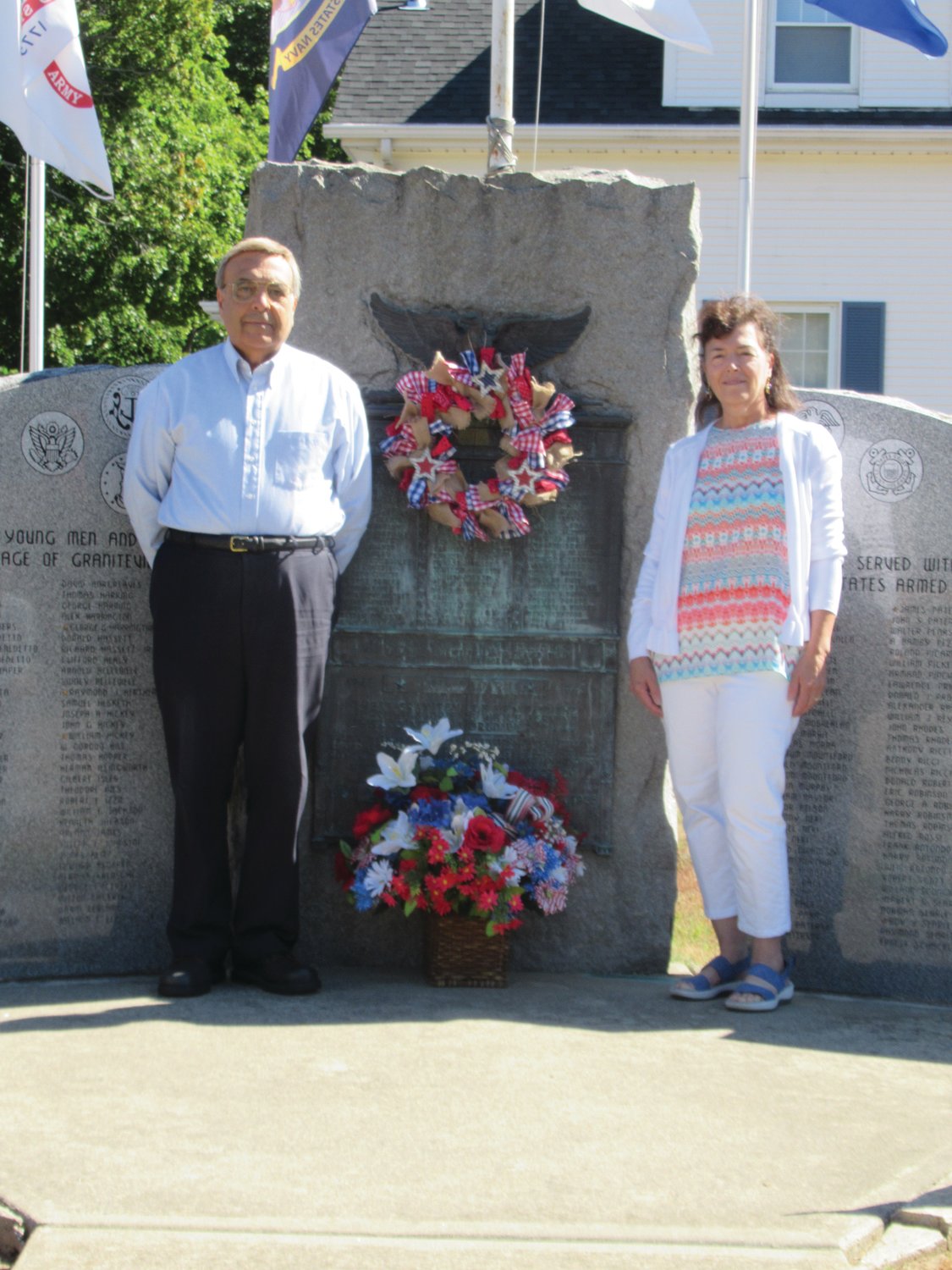 PERFECT PLACEMENT: Marie-Carlino Butera and Steven Morra had the honor of placing the wreath and flowers in front of the famous Graniteville monuments during the recent VJ Day ceremony.
